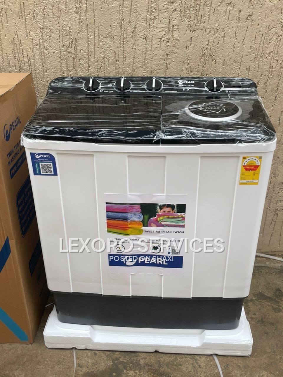 Pearl 12kg Twin Tub Semi-Automatic washing machine, featuring a white and black finish with a transparent lid and rotary controls. photo 1